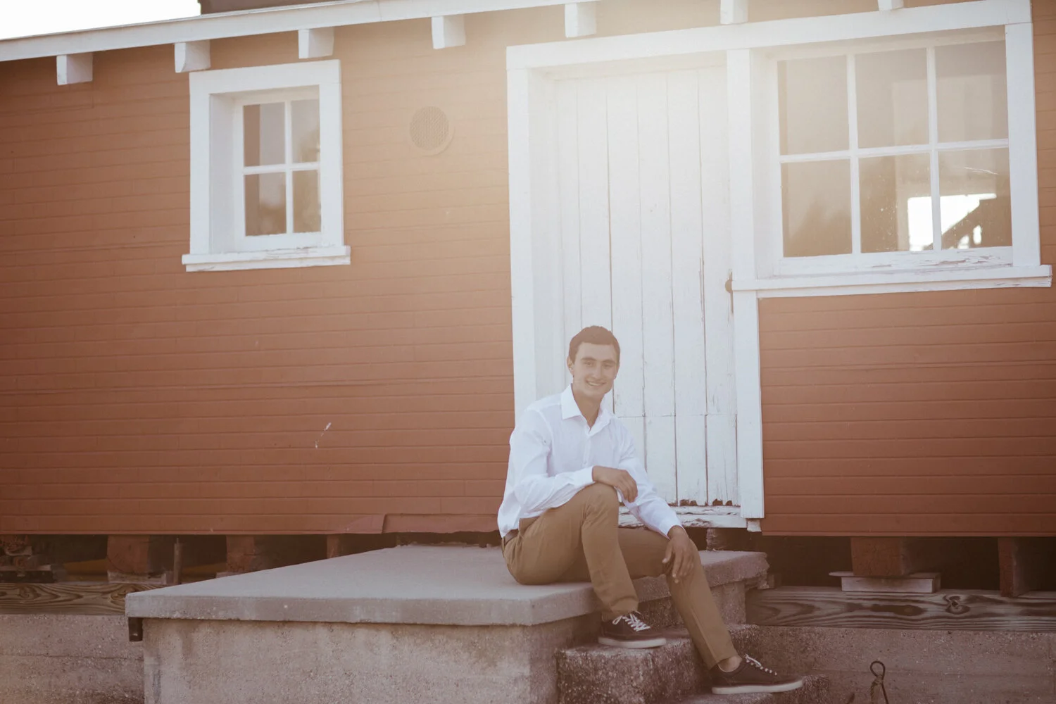 Environmental portrait outside historic Glen Haven building.