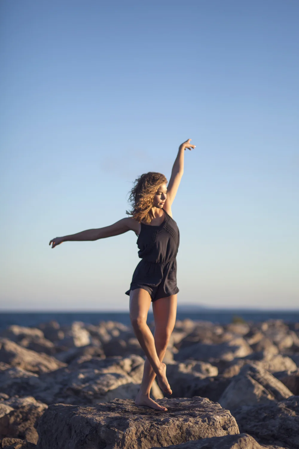 Dance portrait on Lake Michigan breakwater.
