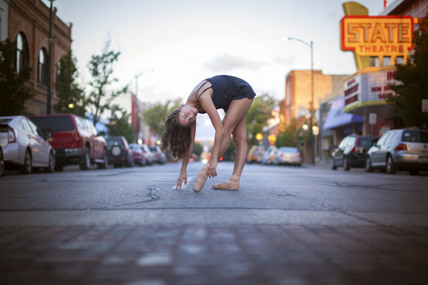Environmental portrait of contemporary dancer performing in downtown Traverse City.