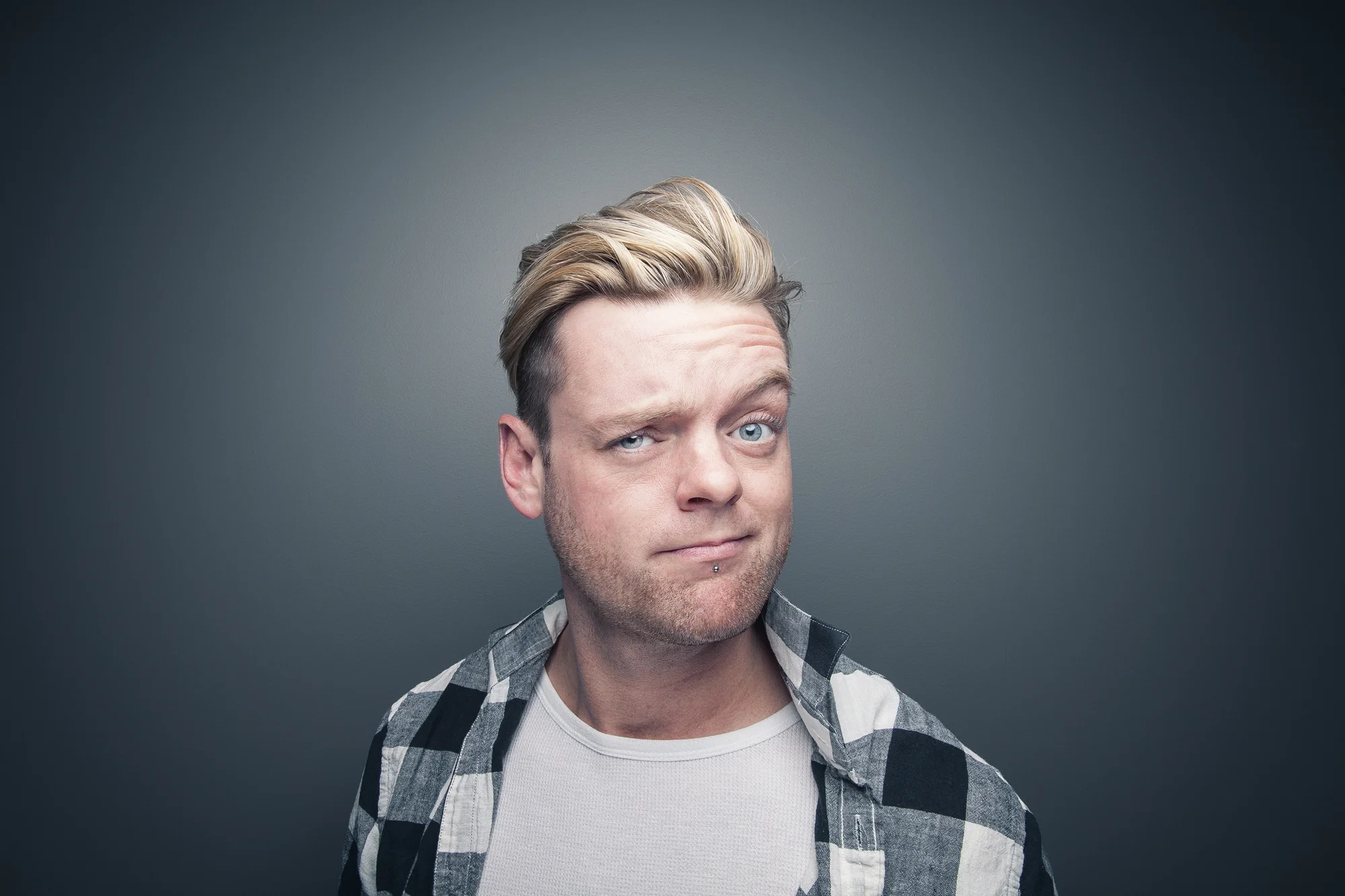 Studio portrait of man making playful expression.