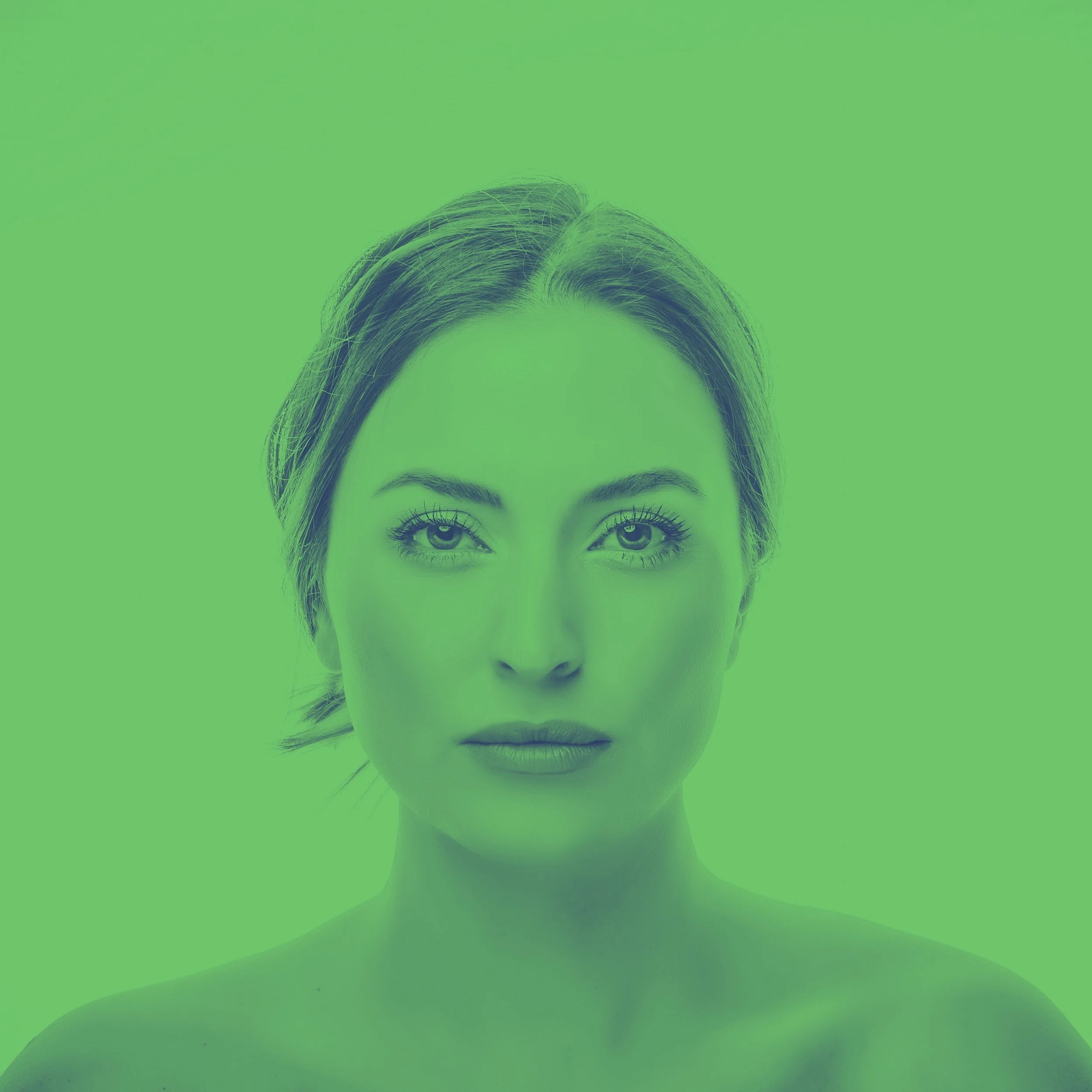 High-key portrait of woman with green tint.