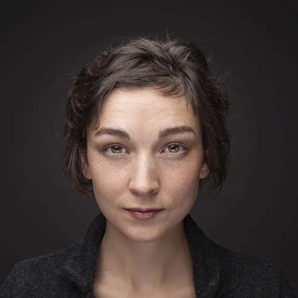 Studio portrait of young woman.