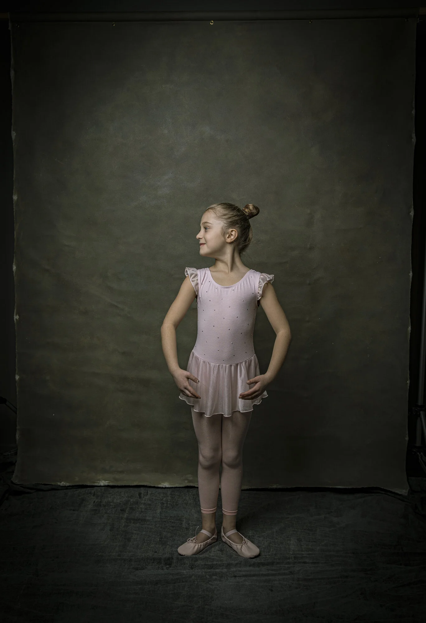 Portrait of young ballet dancer in studio.