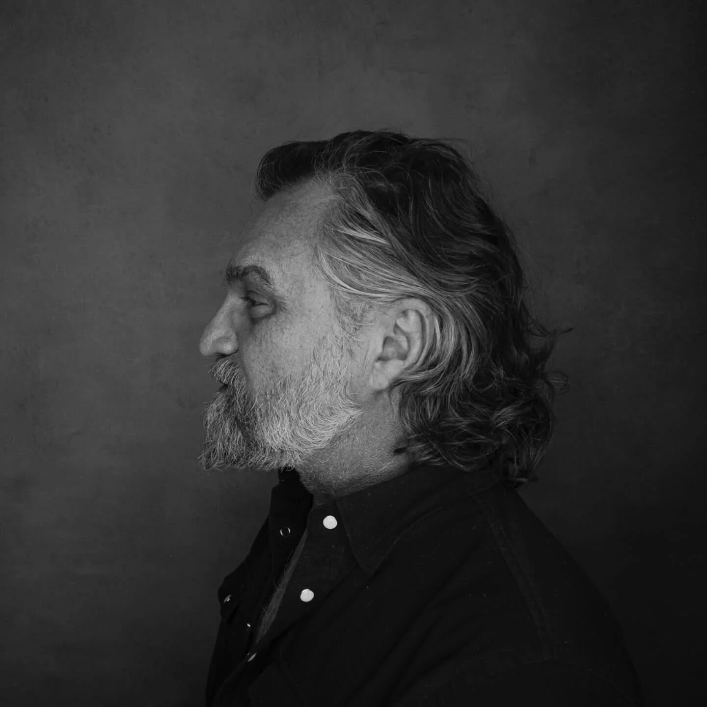 Black and white profile portrait of Tony Roko in studio.