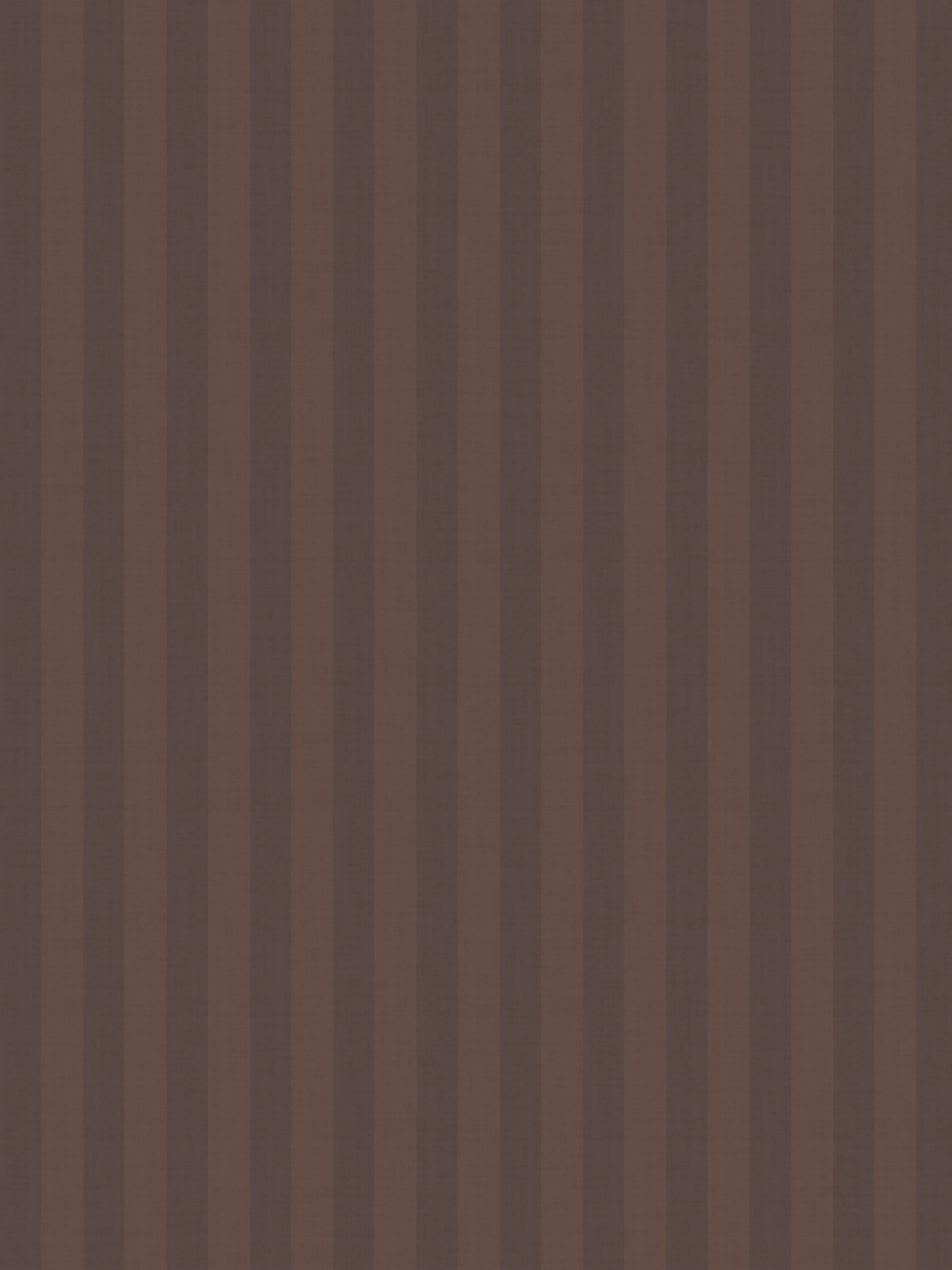 Close-up of a wooden surface with vertical stripes in various shades of brown.