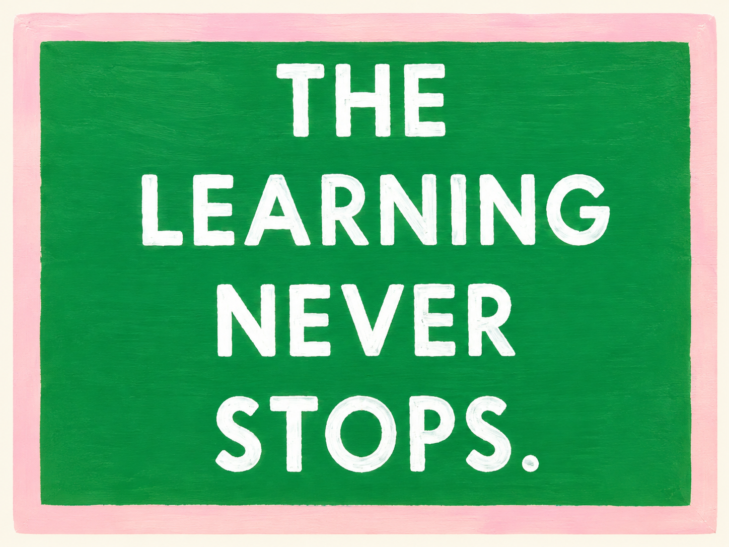 A colorful sign with a green background and pink border that reads: "The Learning Never Stops."