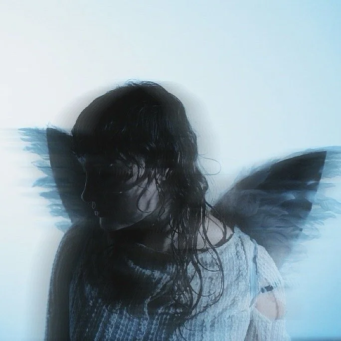 Silhouette of a woman with long, wet hair, wearing a striped shirt, with faint butterfly wings overlayed in the background.