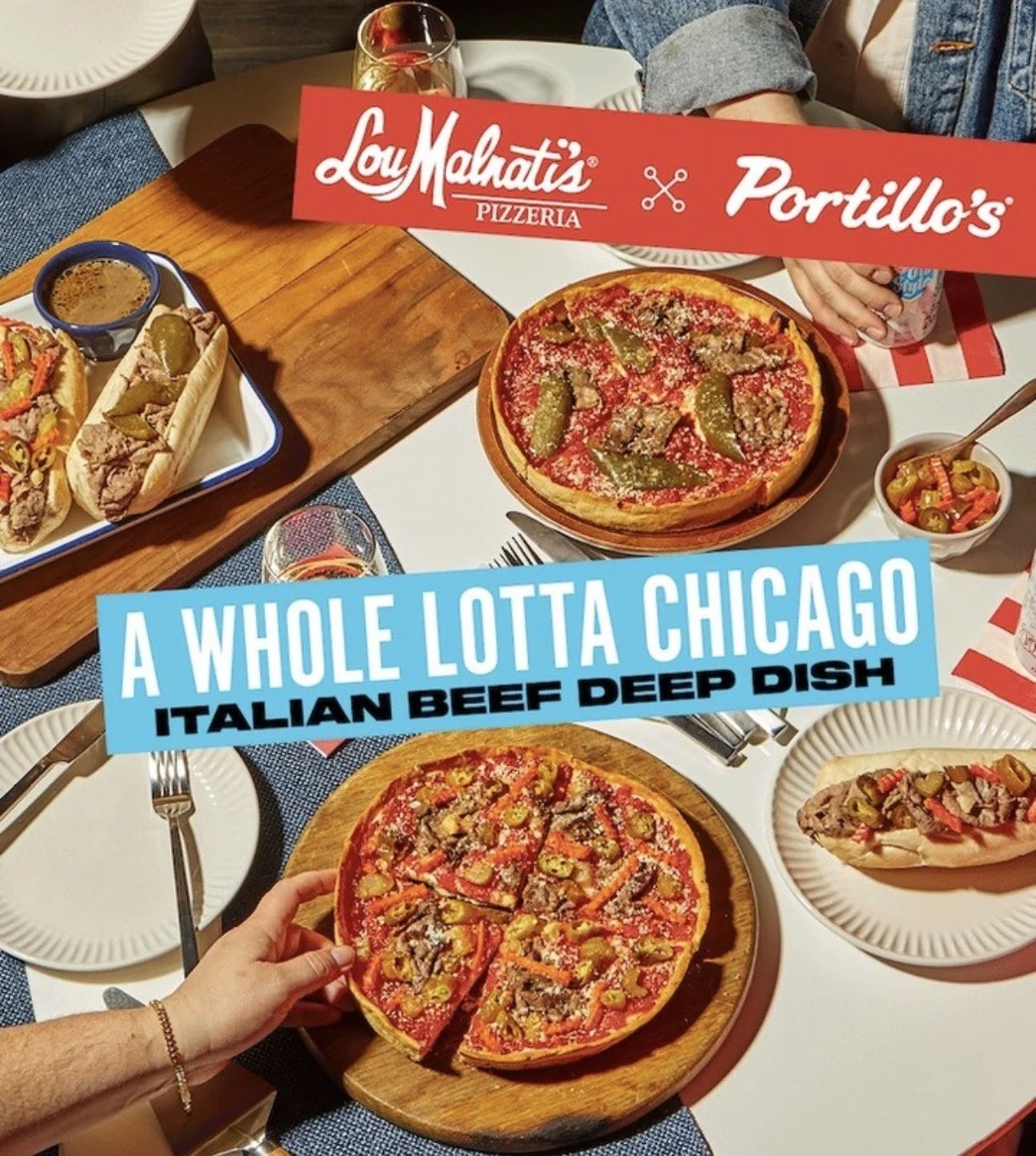 A table with two pizzas, hot dogs, a side of vegetables, and drinks, with colorful text overlay that reads "A Whole Lotta Chicago Italian Beef Deep Dish."