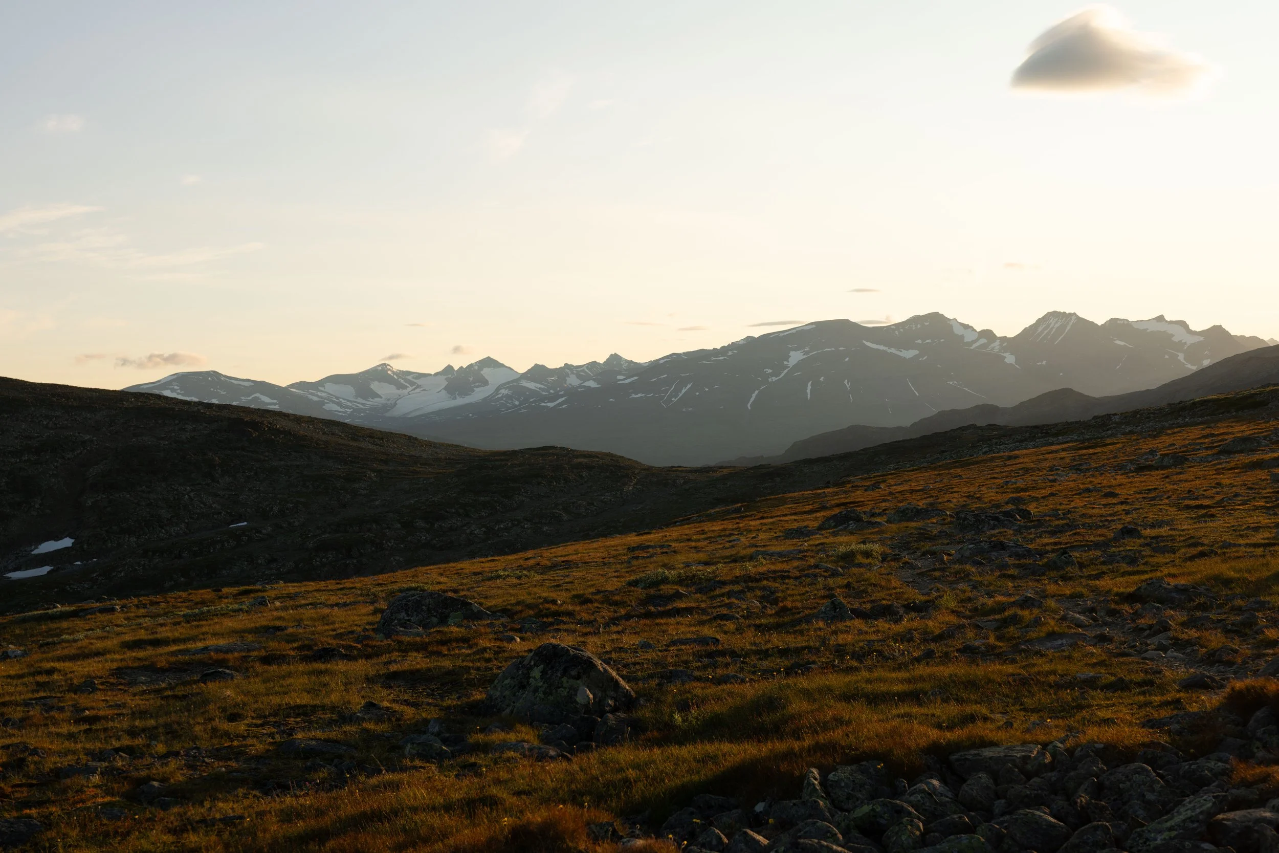 Untouched Scandinavian mountain wilderness in Rapadalen, surrounded by peaks and expansive green valleys