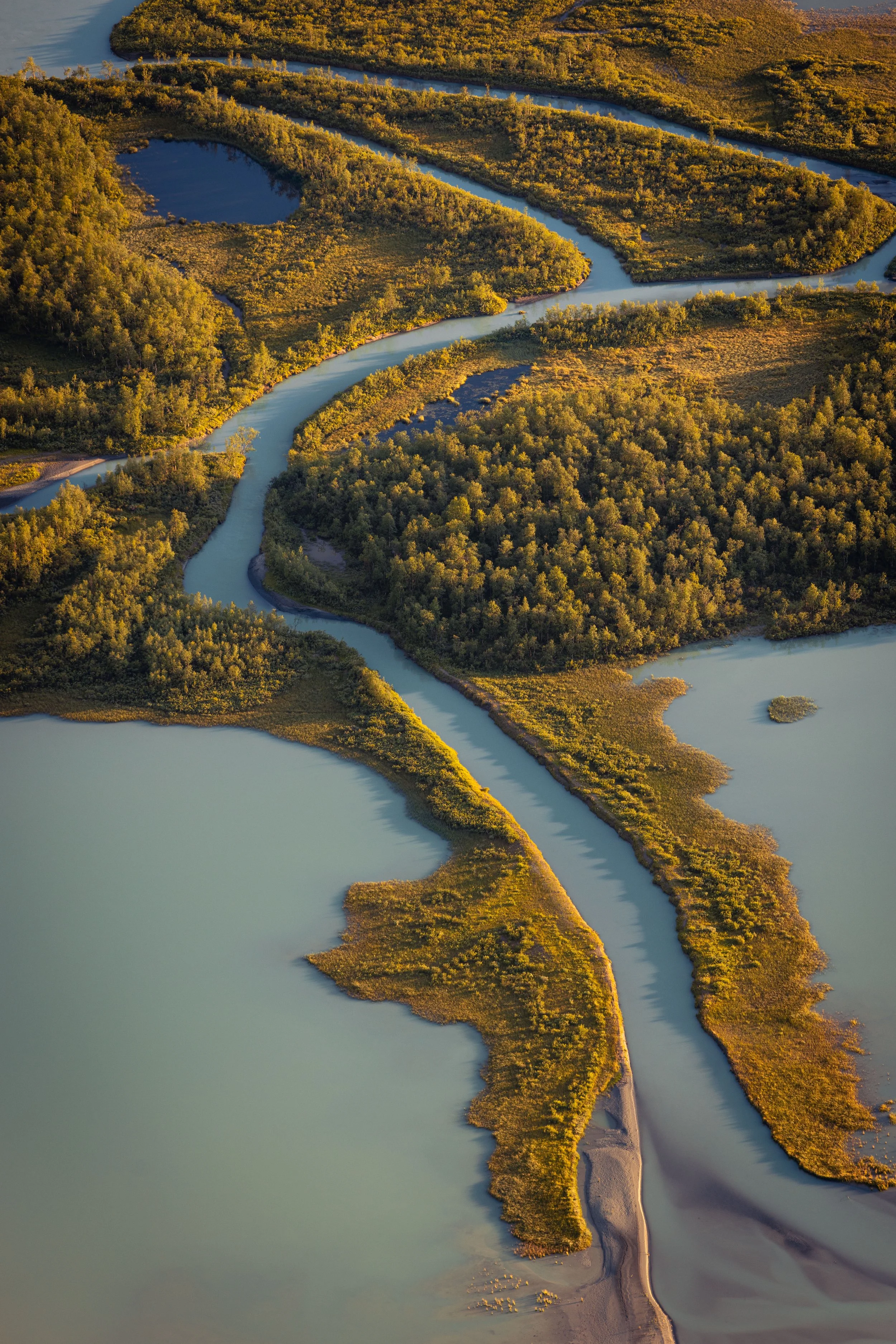 Rapadalen river winding through the vast mountain landscape of Sarek National Park in Swedish Lapland