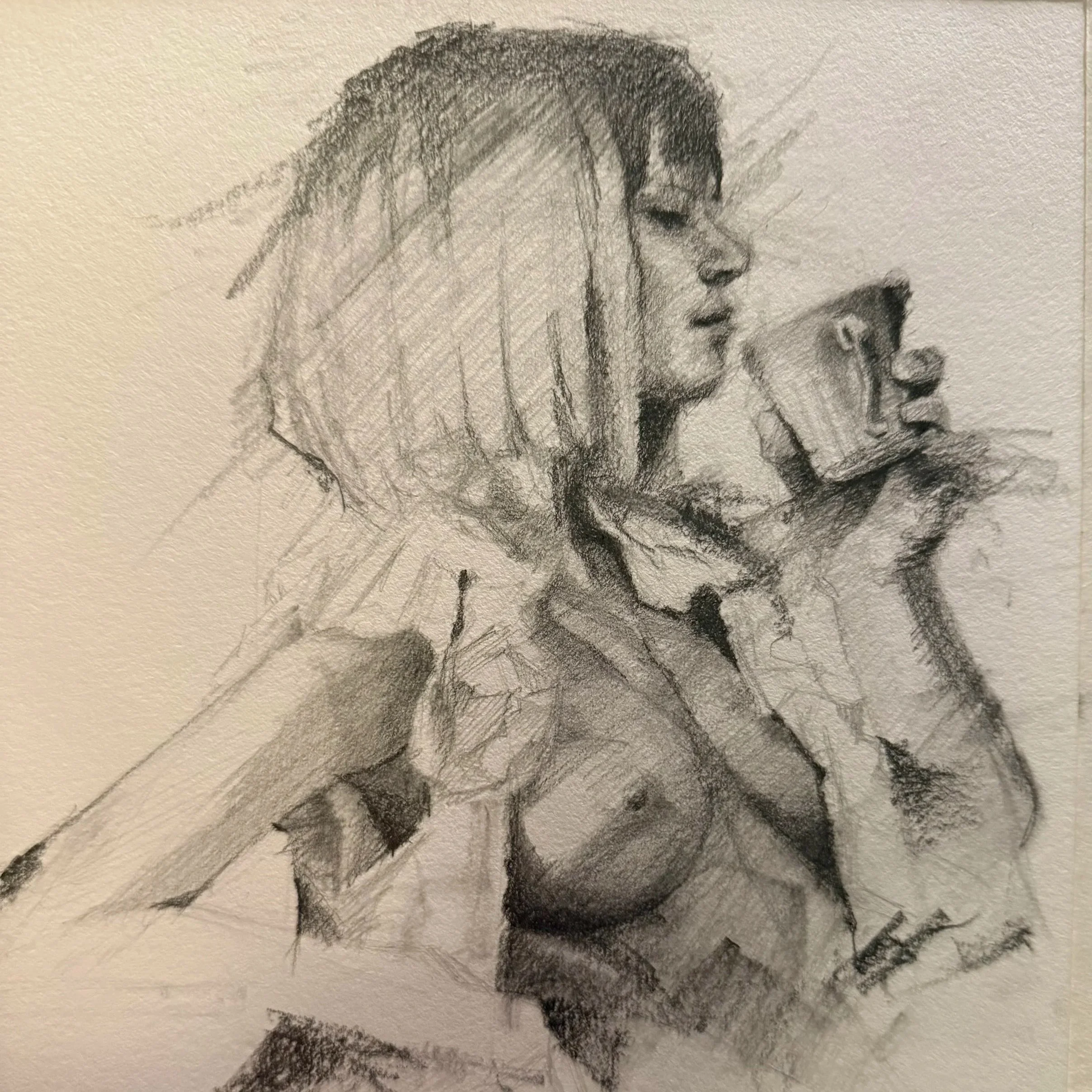 A detailed pencil sketch of a person's side profile, with long hair and facial features outlined with shading.