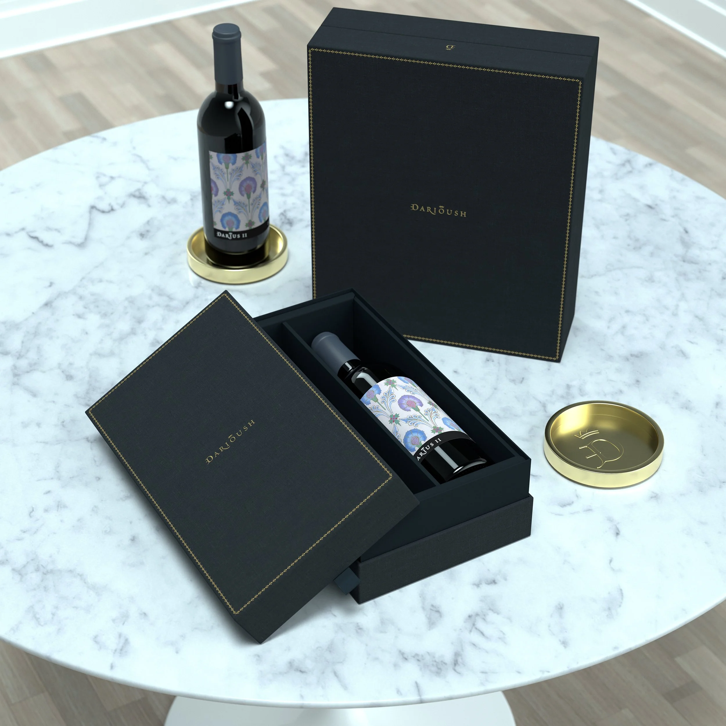 A black boxed perfume set with a bottle of perfume labeled 'Dari Doush', a gold lid, and packaging with floral patterns on a white marble table.