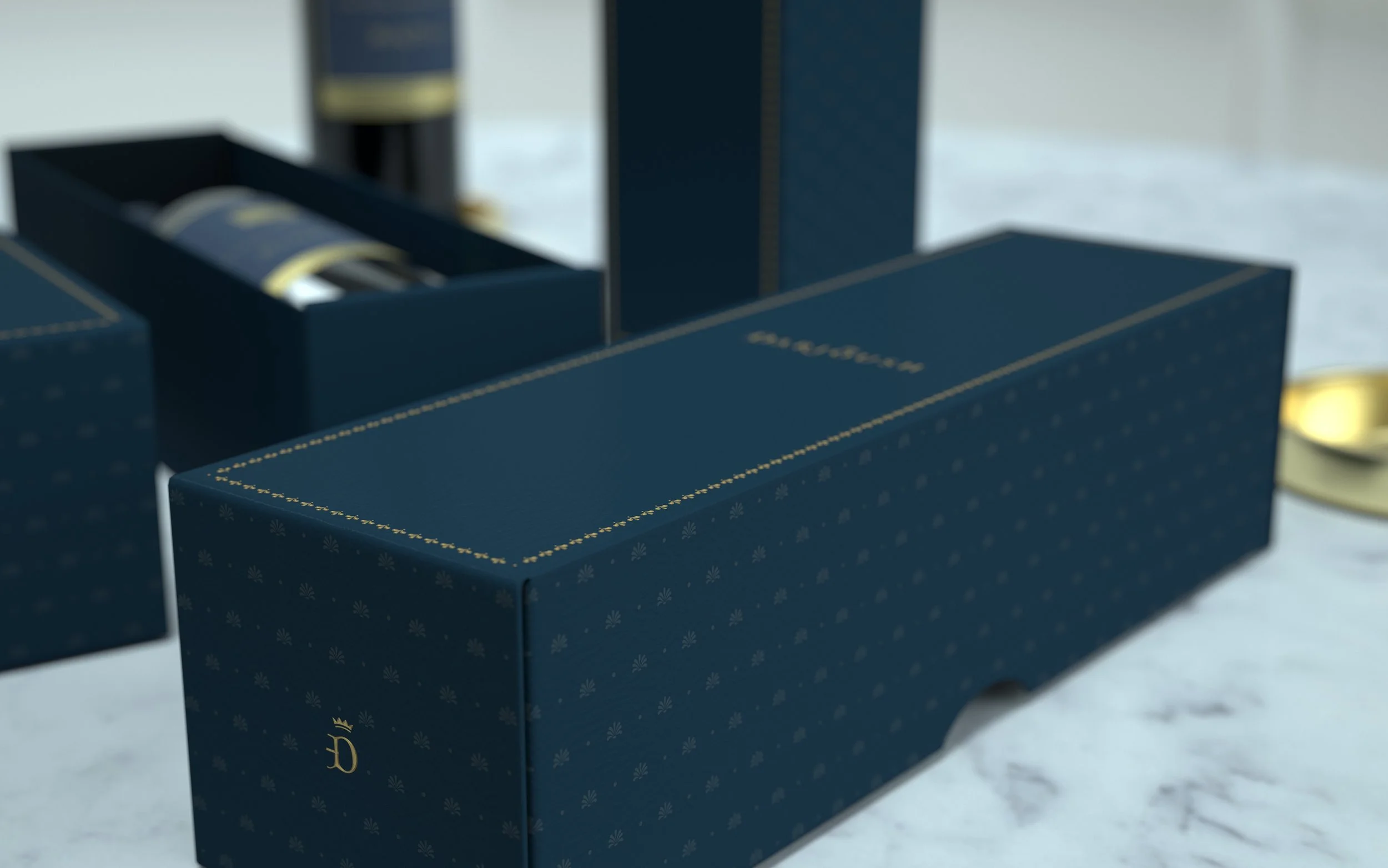 A blue box with gold accents and a logo, containing several rolled tapes or tubes, placed on a light-colored surface.