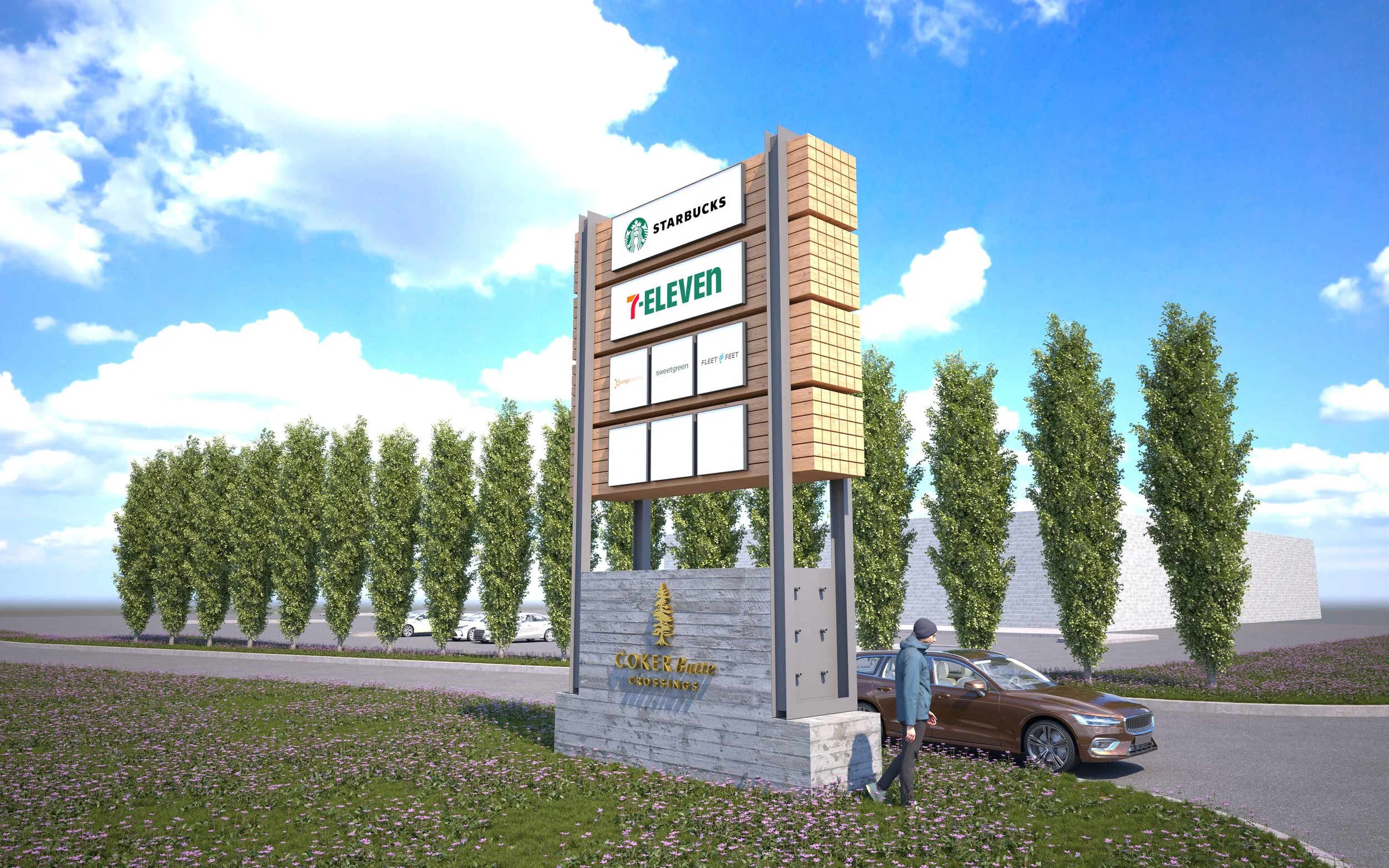 A large outdoor sign for Coker Beautiful Crossings featuring logos for Starbucks and 7-Eleven, with trees and parking in the background, and a person walking nearby under a blue sky with clouds.