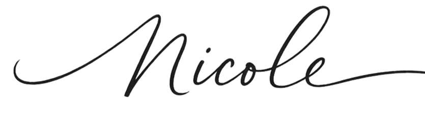 Signature-style text that reads 'Nicole' in black script font.