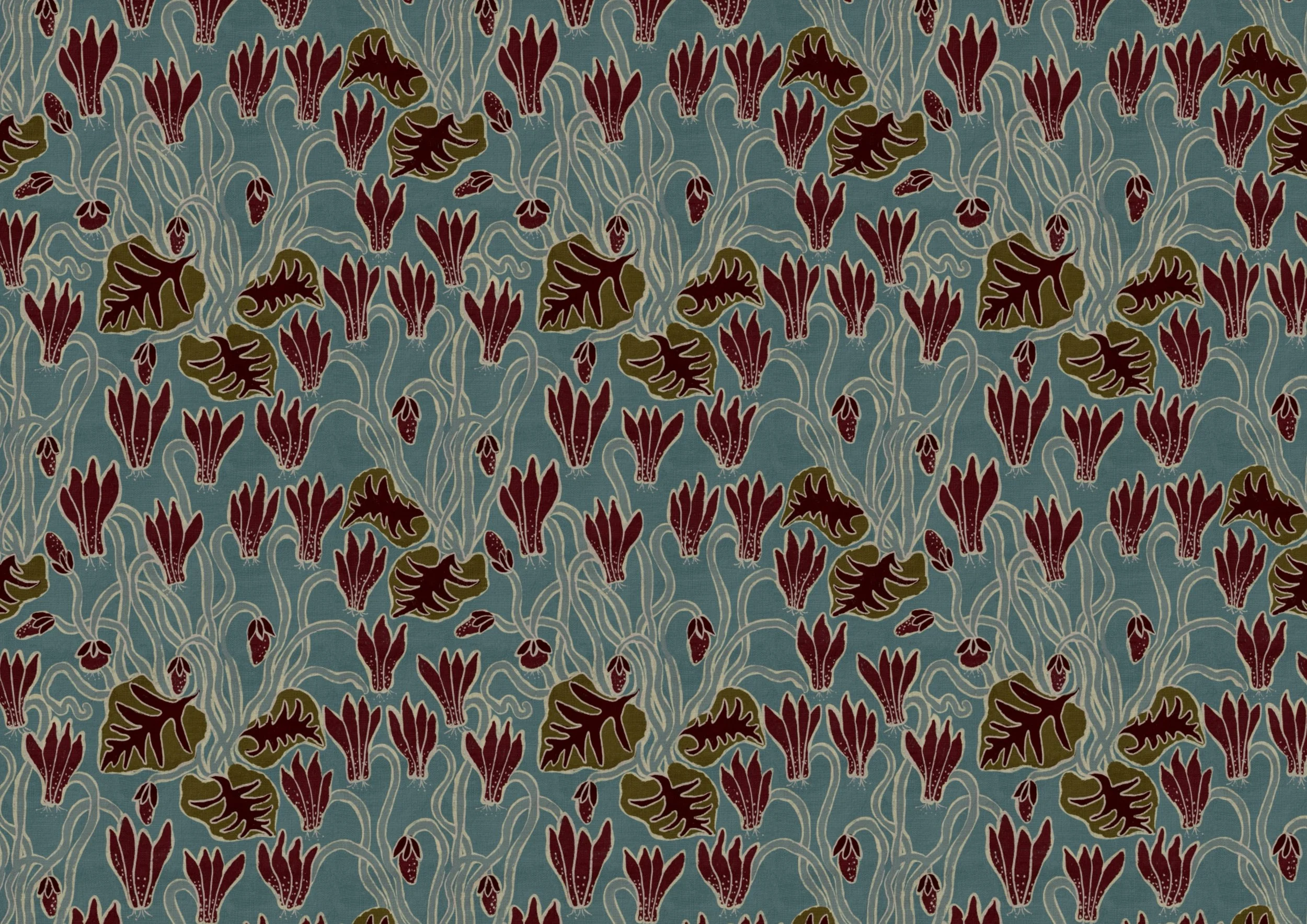A patterned fabric with large maroon flowers and green leaves connected by white stems on a blue background.