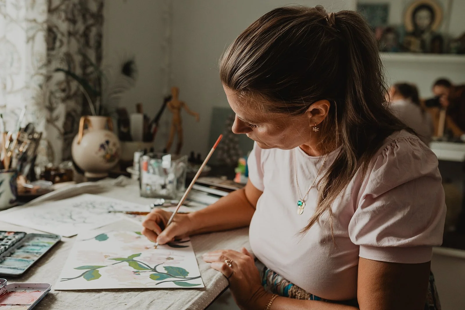 Surface pattern designer Ieva Rudzite of Nordic Duck painting original botanical and floral motifs by hand, inspired by nature, folk art and heritage design.