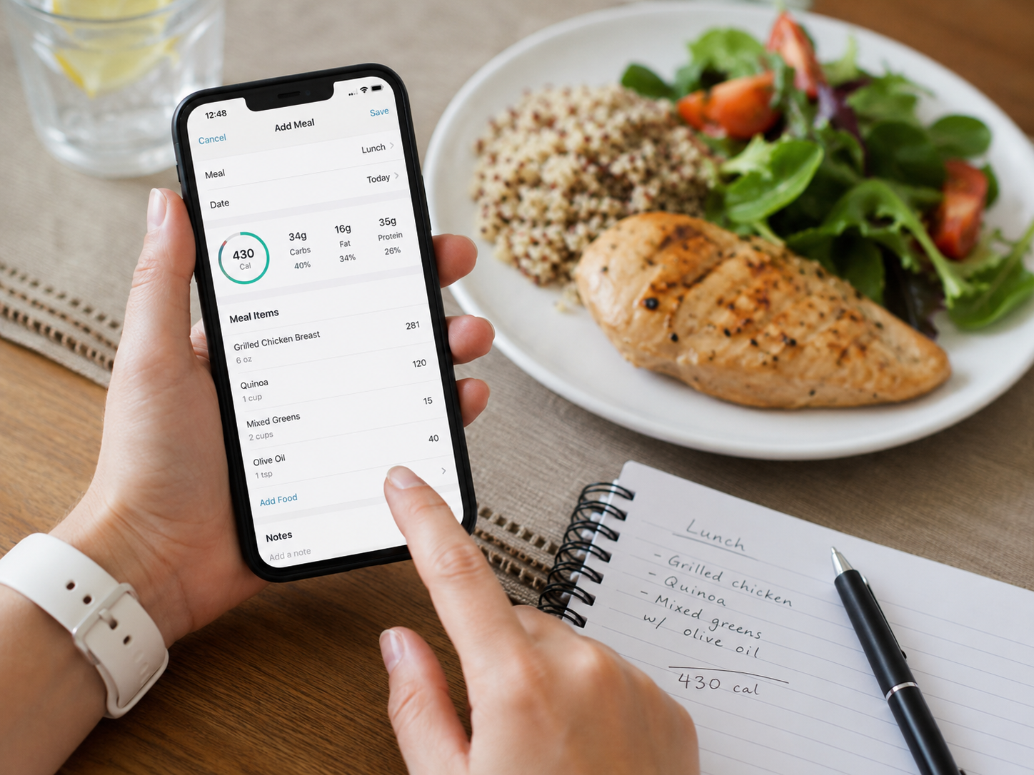 Person logging a balanced meal in a nutrition tracking app with a food journal beside the plate.