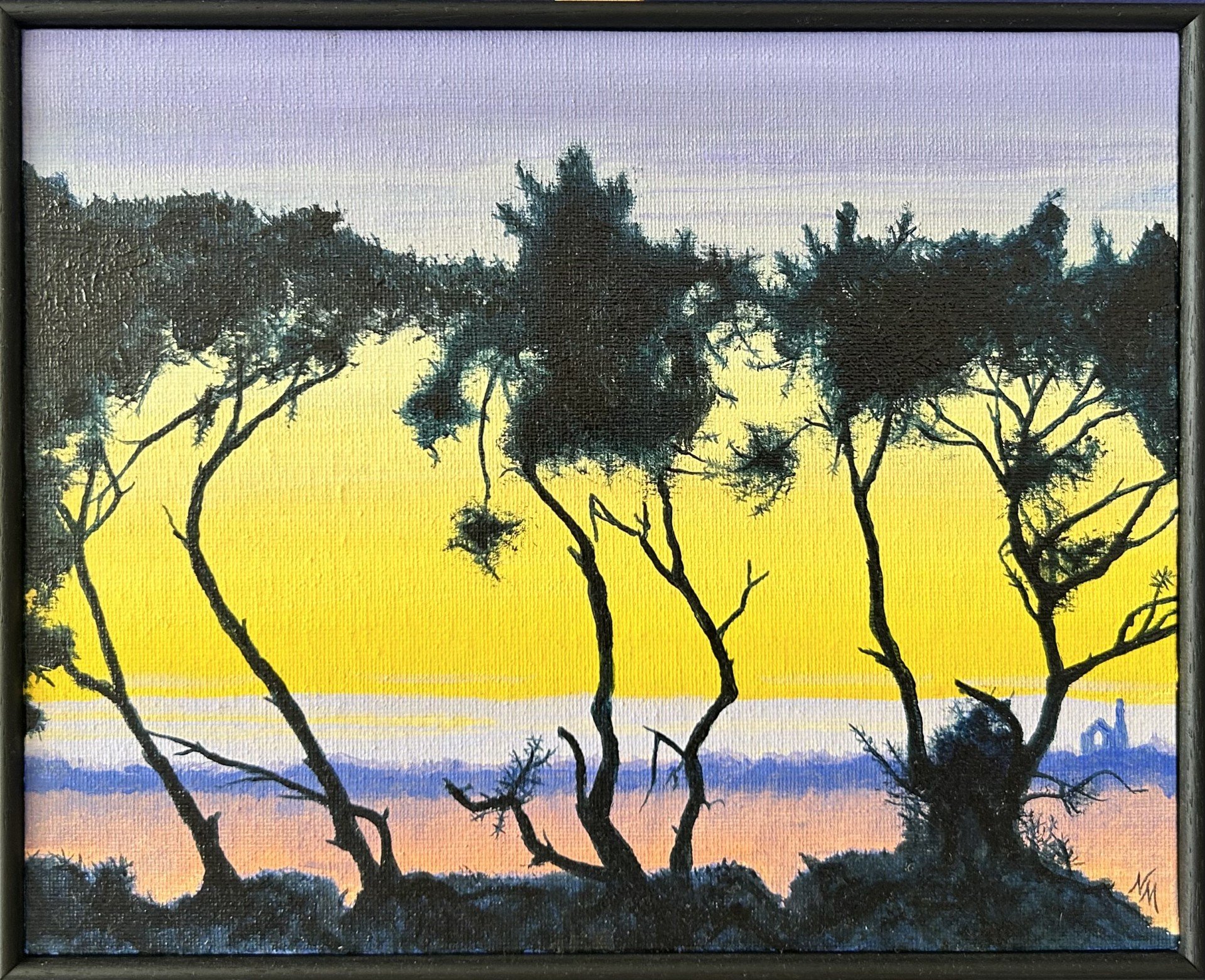 Silhouette of trees against a sunset sky with purple, yellow, orange, and blue hues. A Cornish mining pumphouse on the horizon.