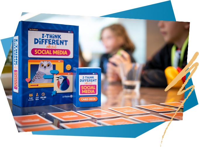 Box and card deck for the educational game "I Think Different About Social Media," with game pieces and two children in the background.