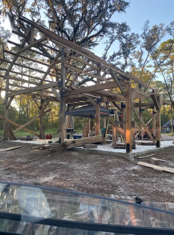 Construction site with wooden framework for a building or house during daylight