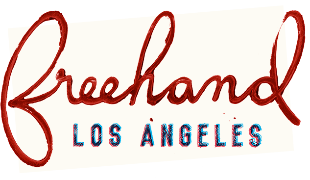 Sign reading 'Breckland LOS ANGELES' in red cursive and blue block letters