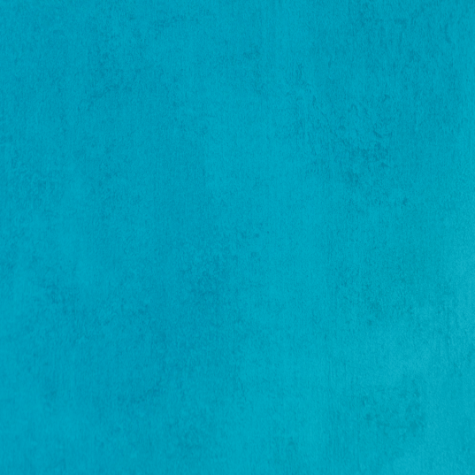 Close-up of teal-colored textured paper or fabric.