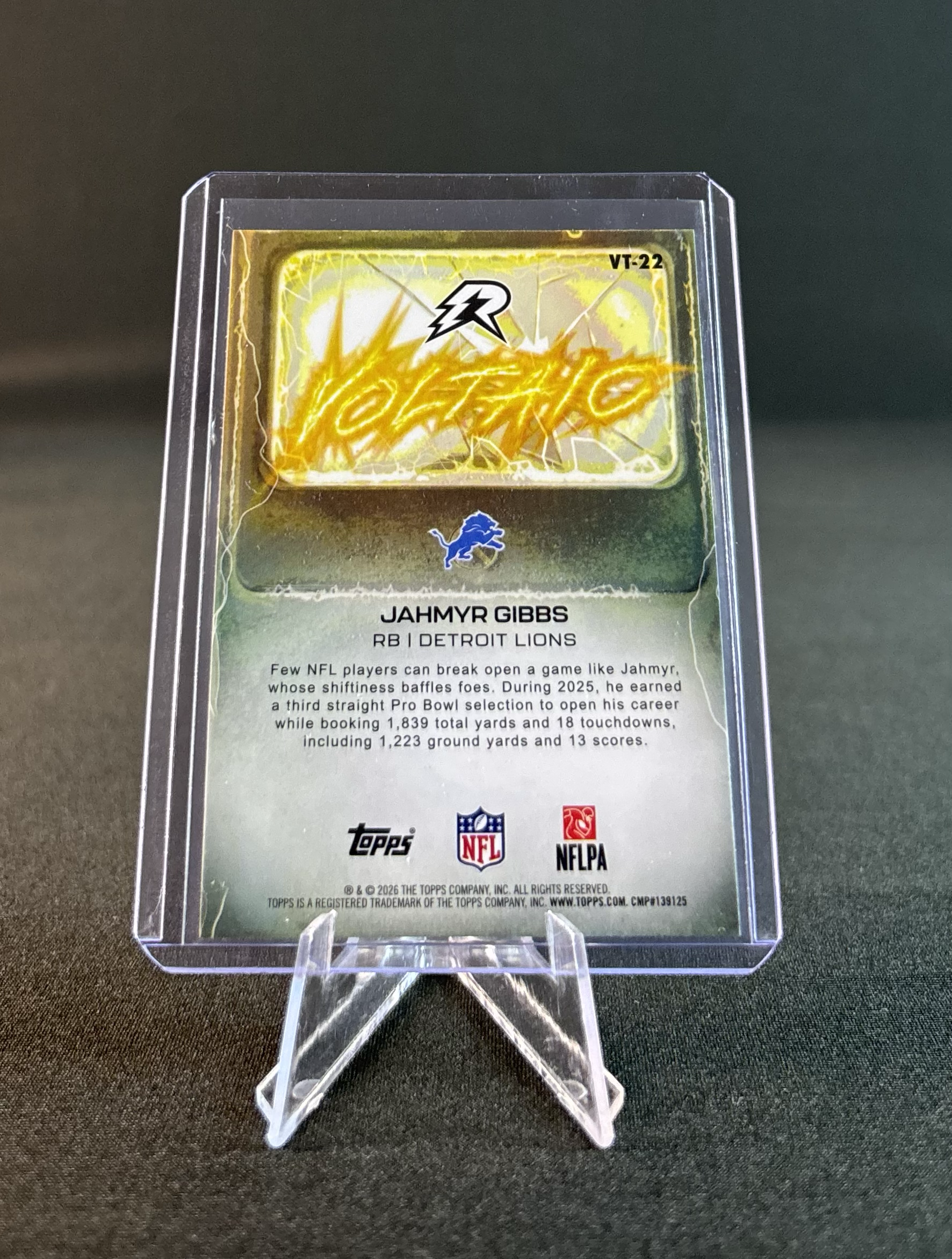 NFL trading card of Jahmyr Gibbs, Detroit Lions running back, in a clear plastic display case.