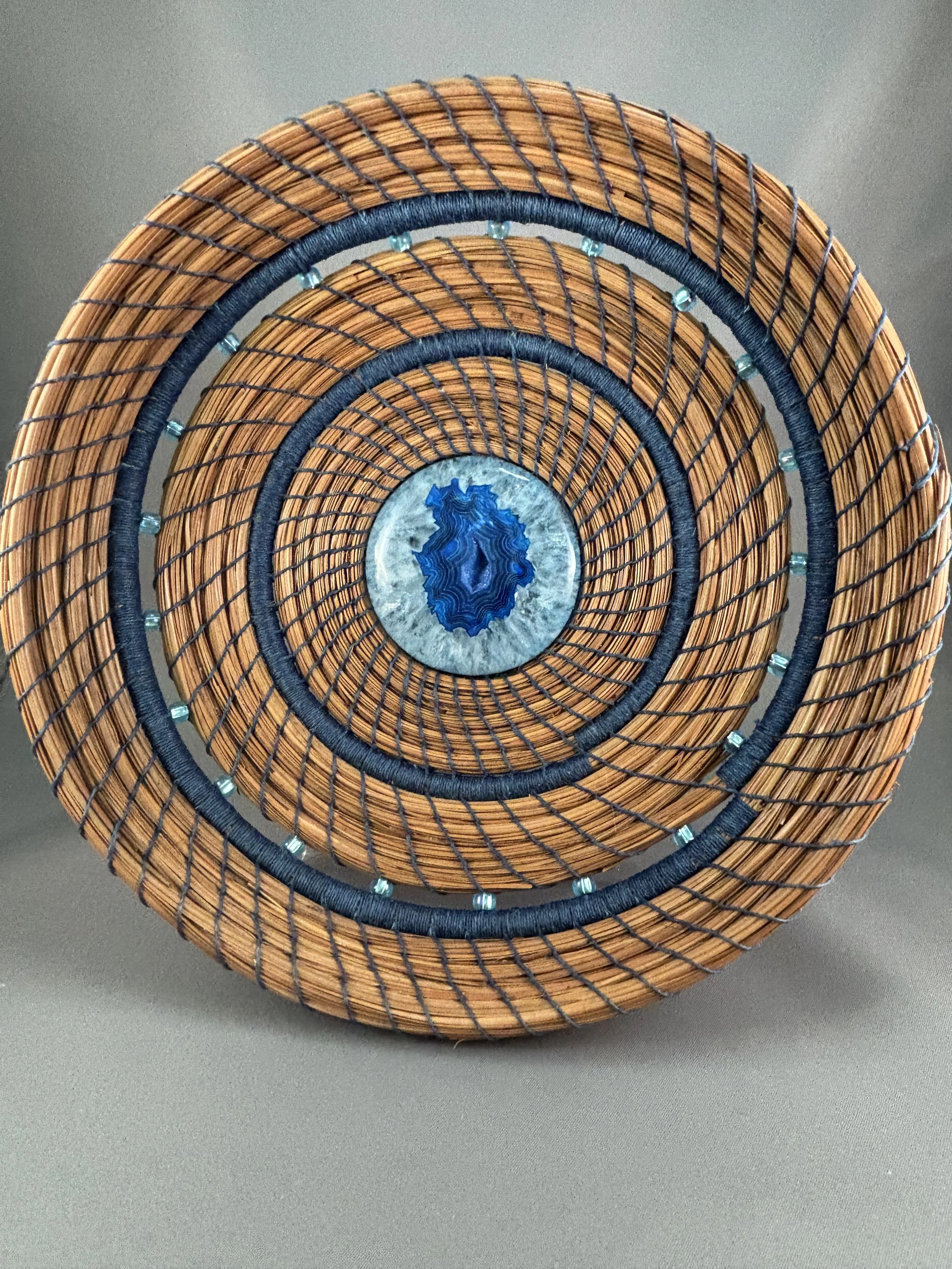 Blue Horizon original pine needle basket with treated blue druzy and royal blue stitching