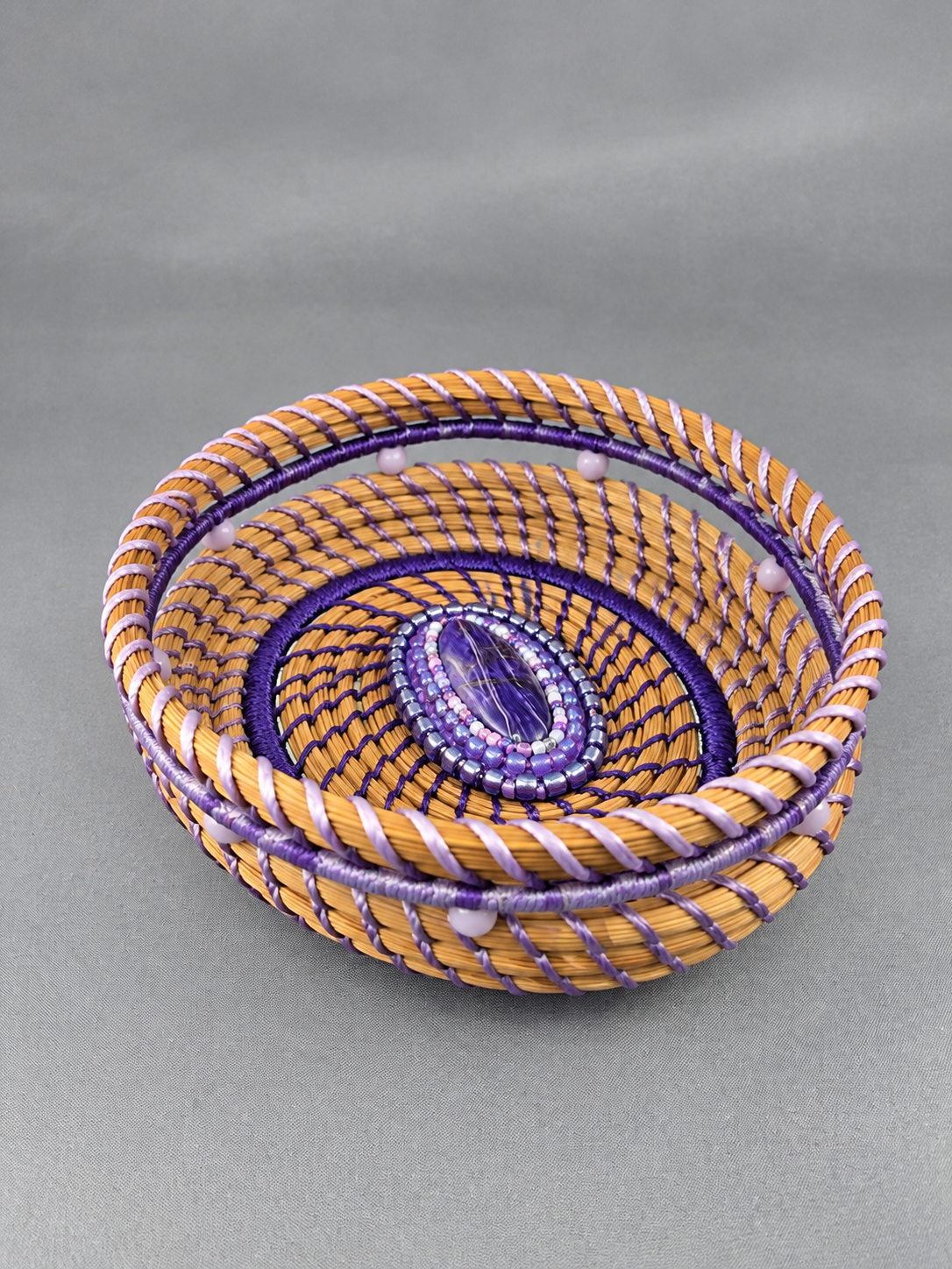 Violet-drift-charoite-longleaf-pine-needle-basket-side-view.png
