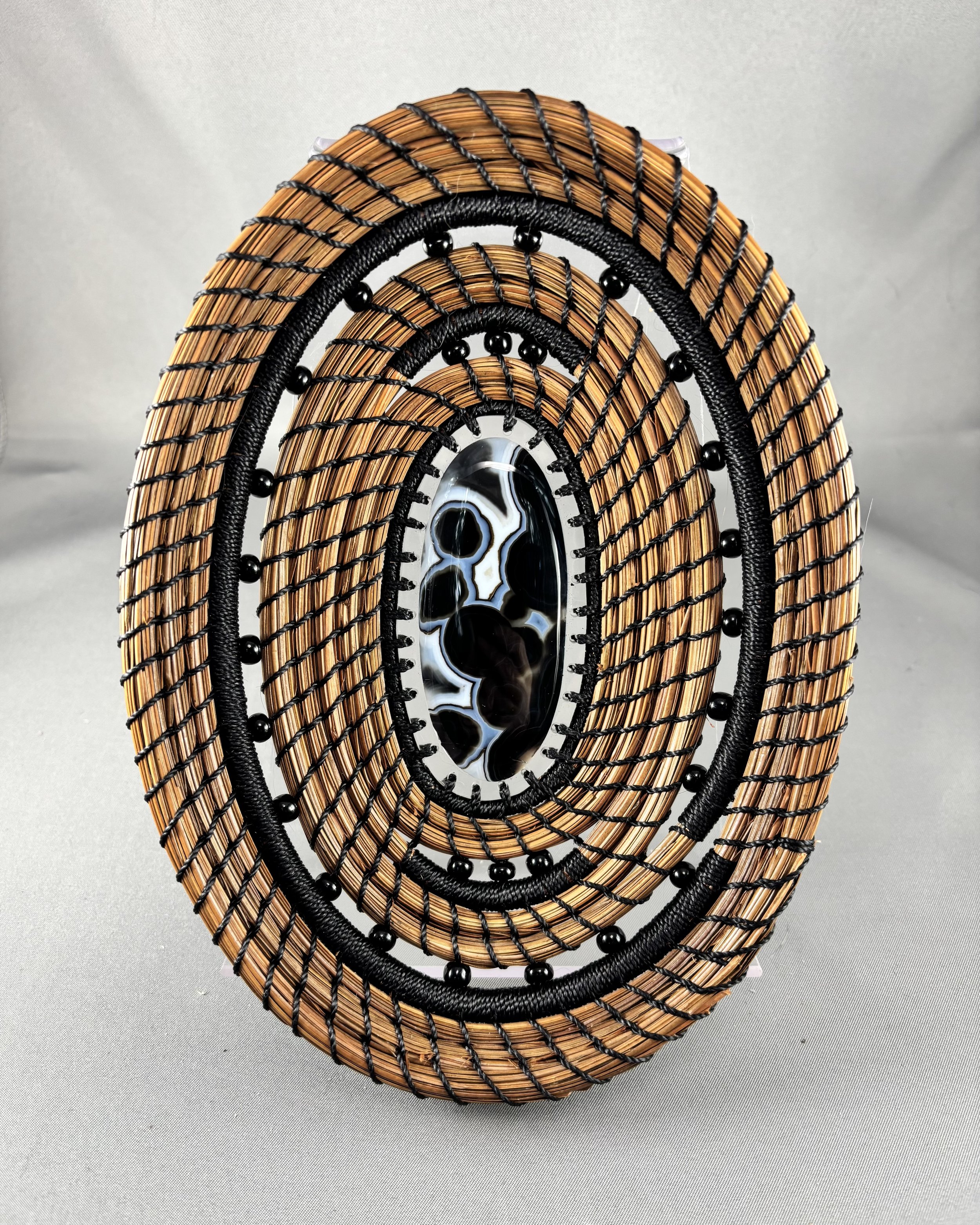 Dark Tides contemporary longleaf pine needle basket with Gobi eye agate center
