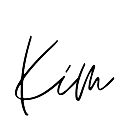 The word 'Kim' written in black cursive handwriting on a white background.