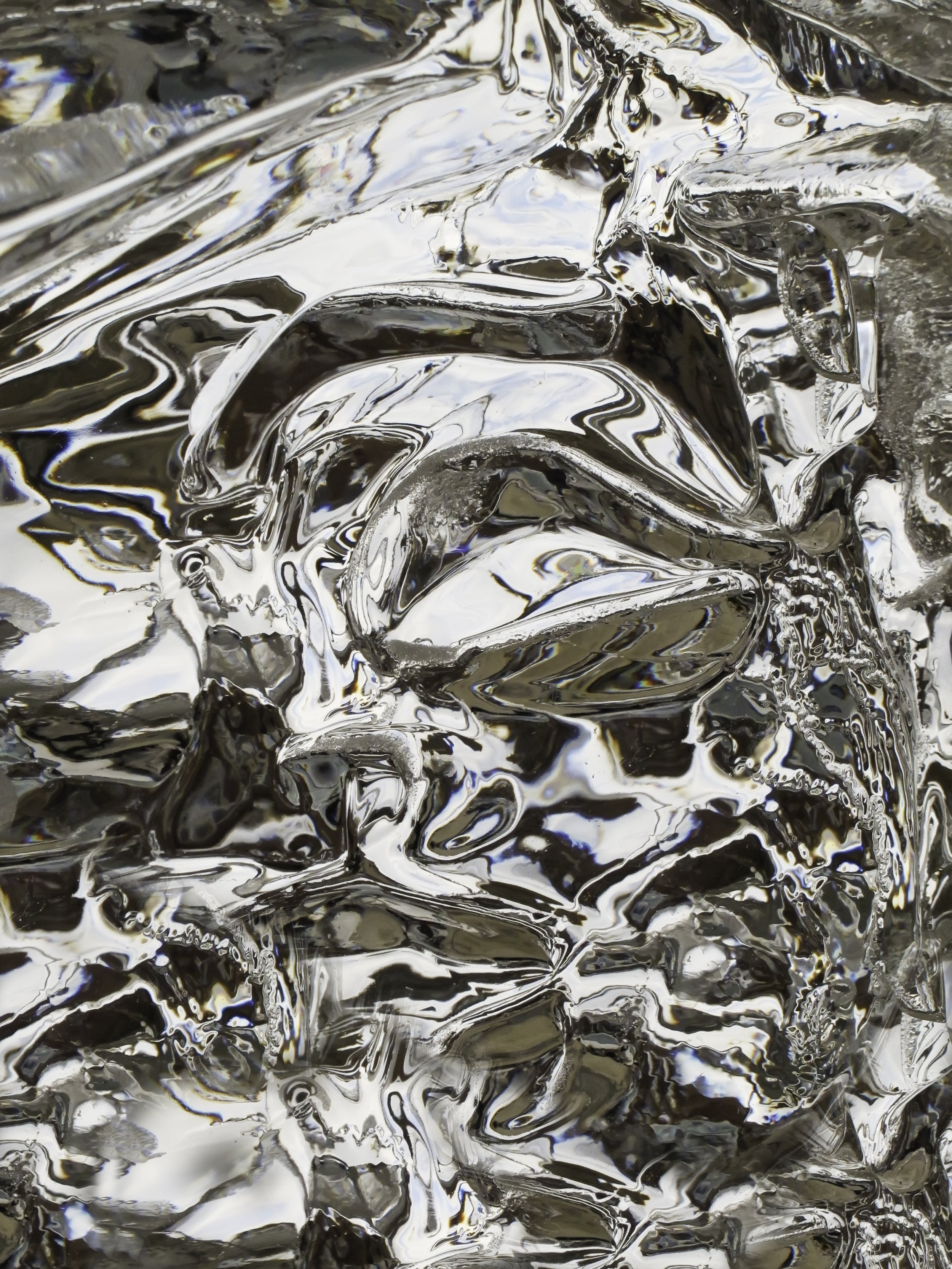 Close-up view of crumpled shiny metallic foil.