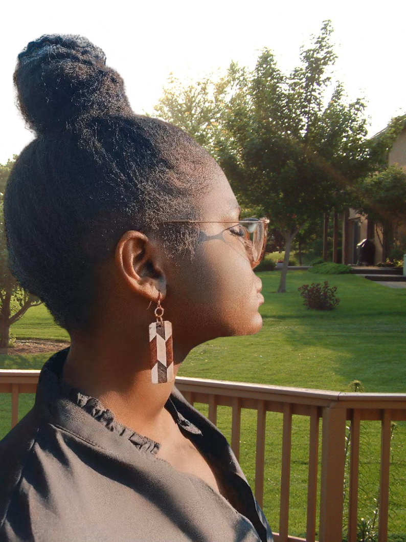 A Woman Standing on Her Deck with Her Eyes Clothes Wearing Long Square Mosiac Earrings from the WooDesignsByAdiantie Wearable Art Collection