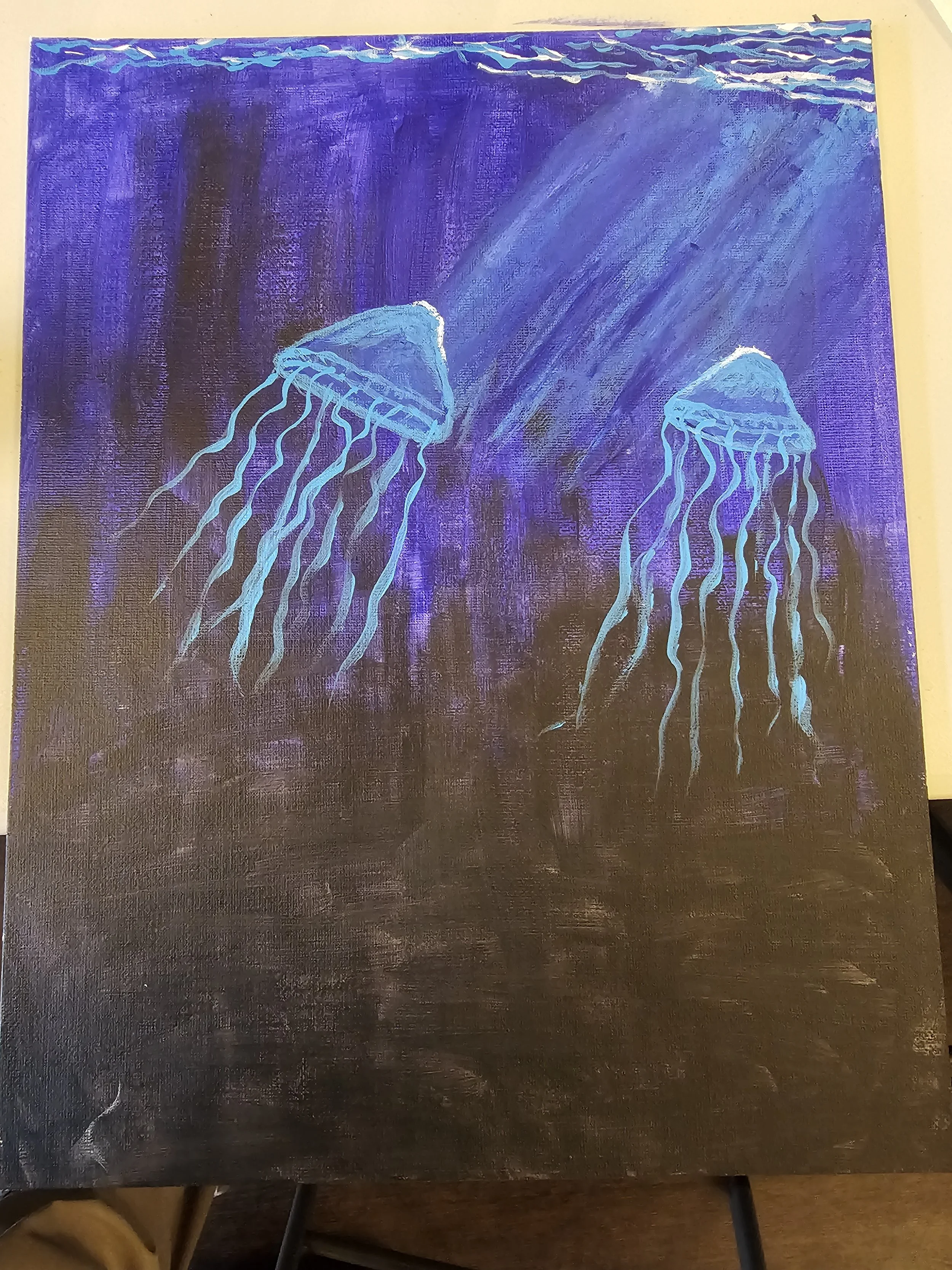 A painting of two glowing jellyfish with long tentacles in shades of blue and white, set against a dark purple background.