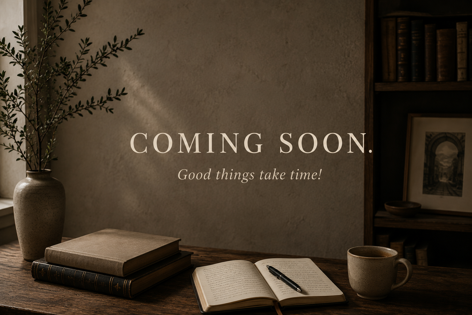 A cozy wooden desk with a stack of books, an open notebook with a pen, a cup, and a vase with greenery against a textured wall. Text overlay says "COMING SOON. Good things take time!"