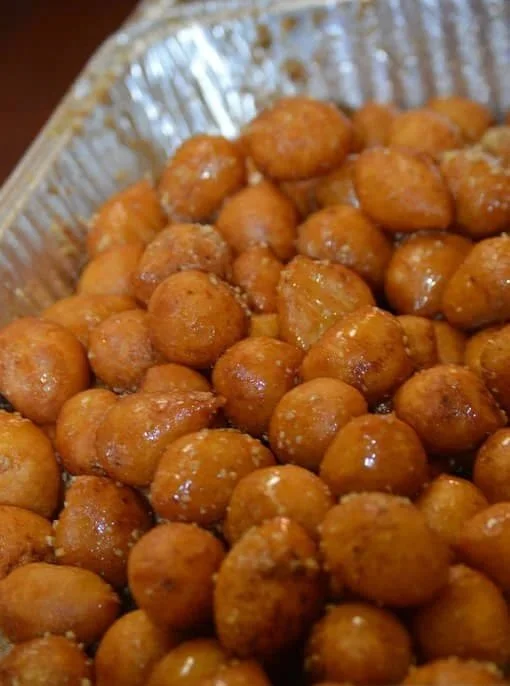 A tray of loukoumades, Greek golden honeyed fried donuts, at the Belmont Greek Festival