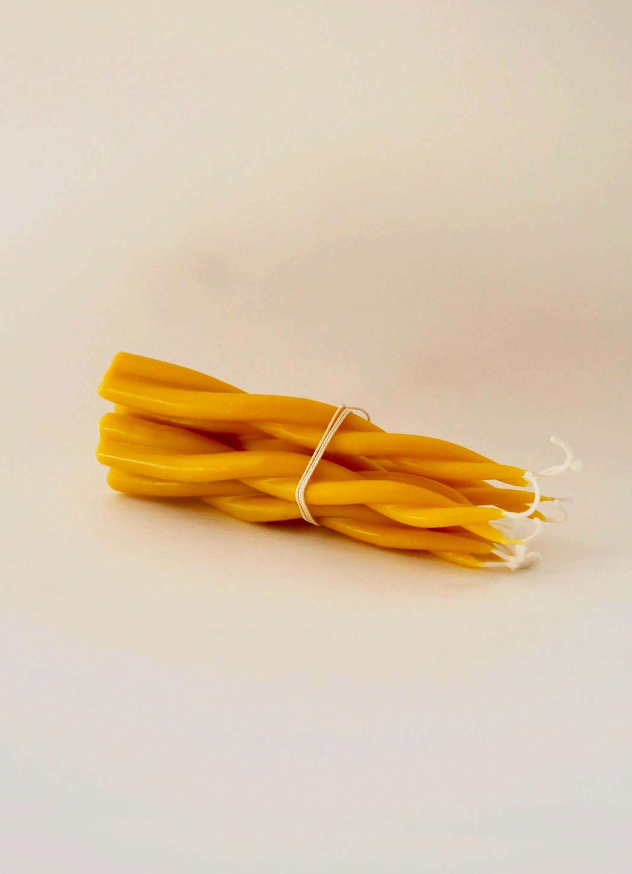 Beeswax twisted tapered candlesticks for clean burning unscented natural candlelight.