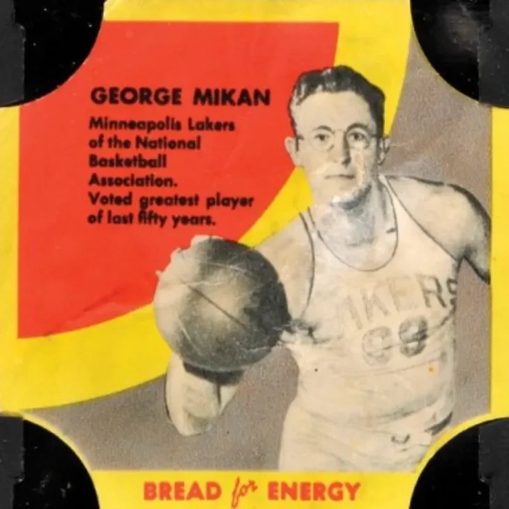 A vintage-style poster featuring George Mikan, a former Minneapolis Lakers basketball player, holding a basketball. The poster notes that he was voted the greatest player of the last fifty years and includes the slogan 'BREAD for ENERGY' at the bottom.