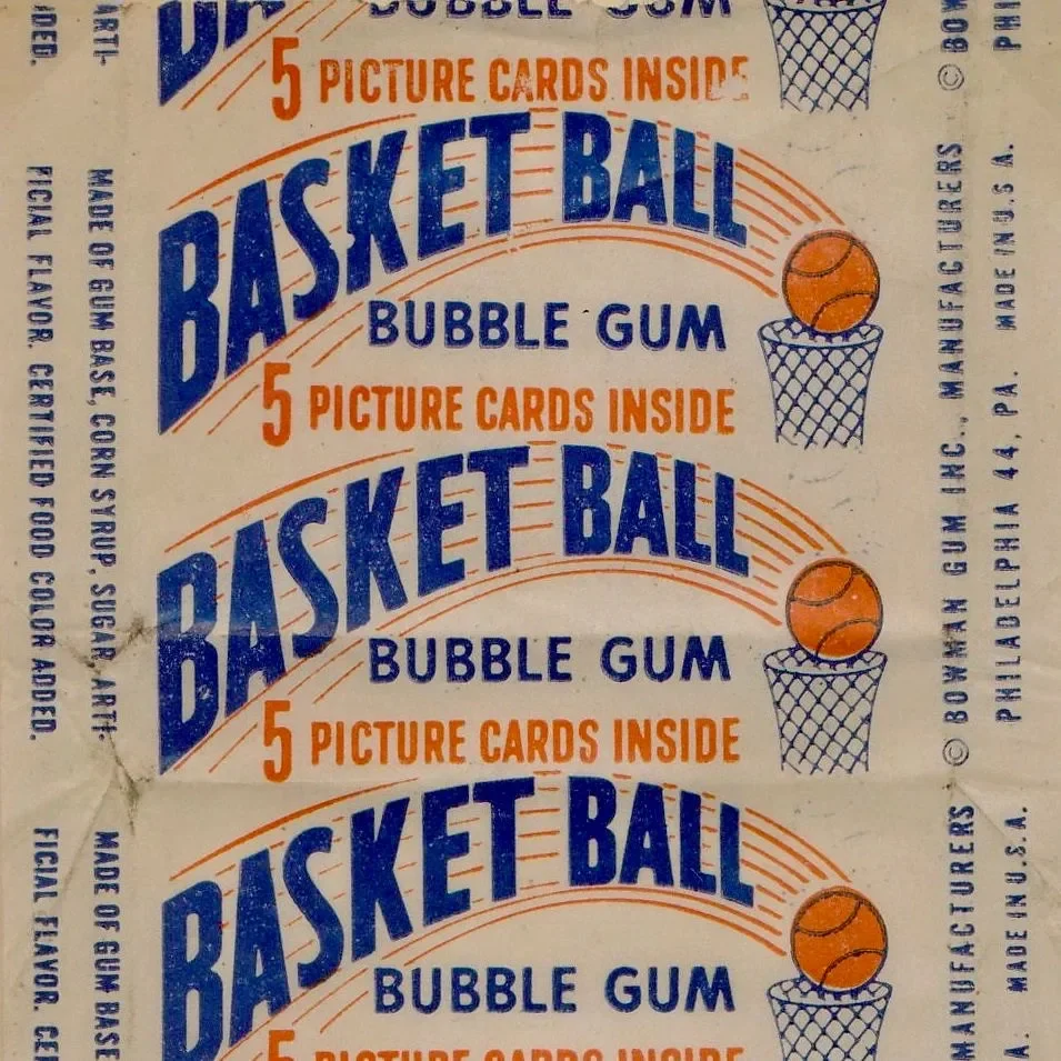 Vintage candy wrapper advertising basketball bubble gum with 5 picture cards inside, featuring blue and orange text with illustrations of a basketball and a hoop.