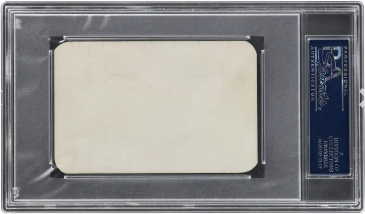 A security or grade mark certification label with a silver border and a blue and white sticker on the right side, indicating authenticity and approval.