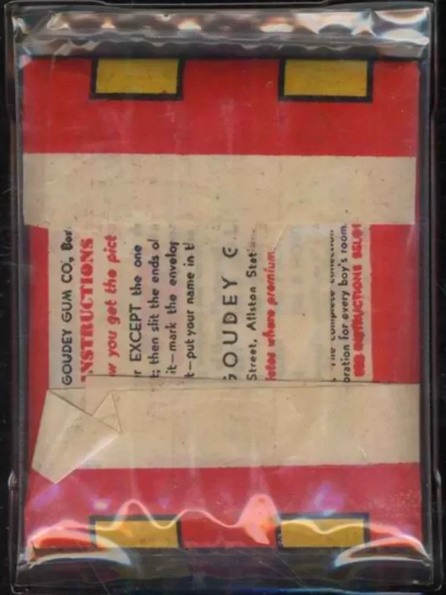 A vintage pack of Juicy Fruit chewing gum in its original packaging, showing the red and white design with text and warnings, still in sealed plastic.