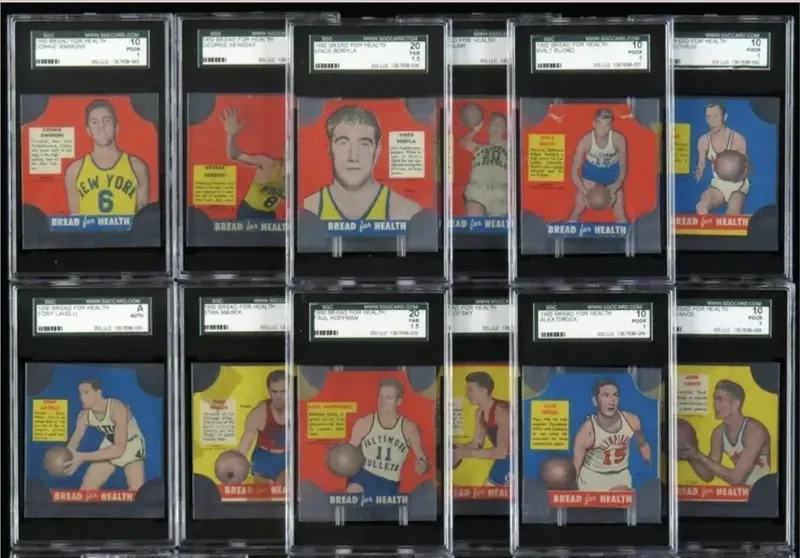 A display of twelve basketball trading cards featuring players in colorful jerseys, arranged in a grid with three rows and four columns, each protected in plastic cases.