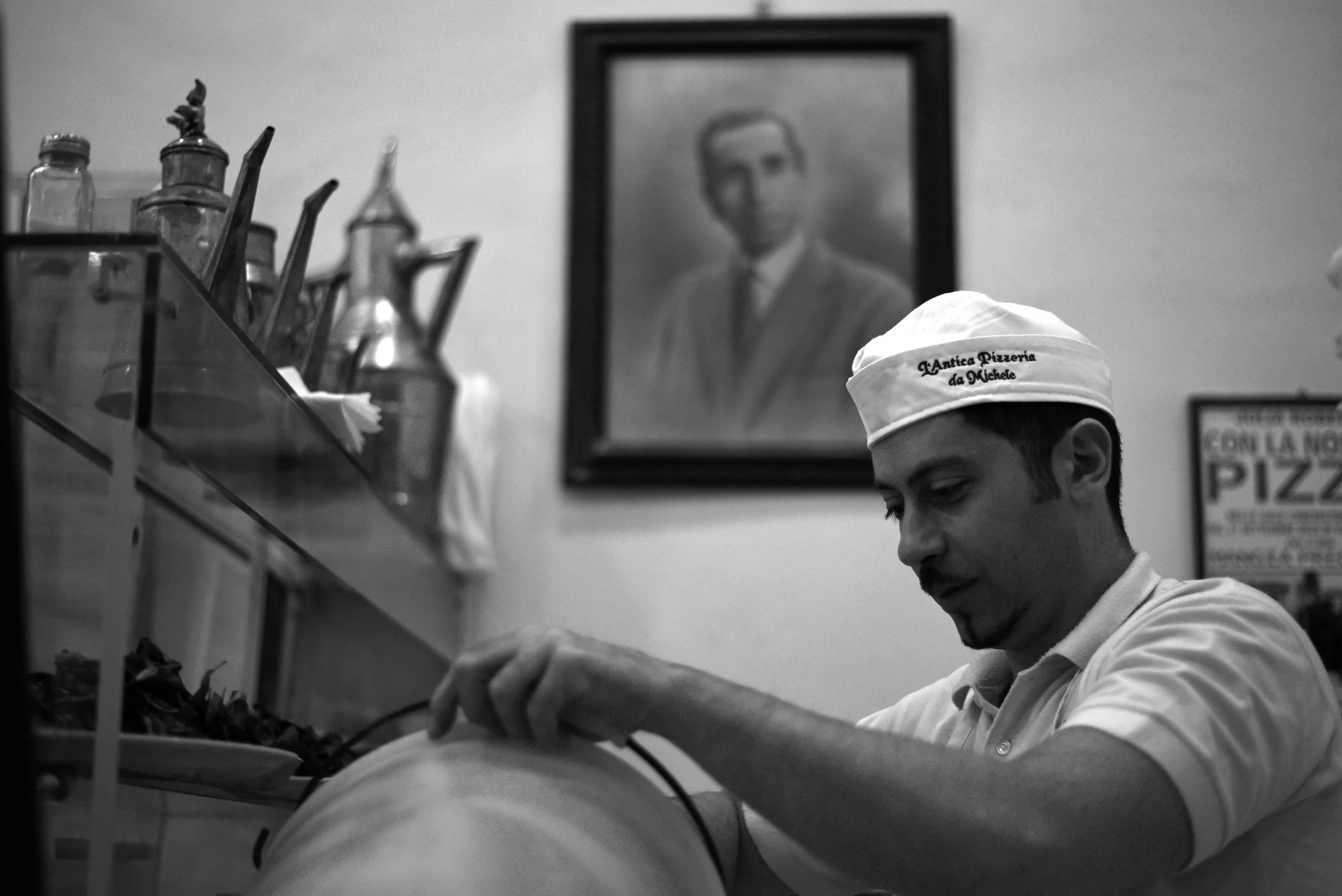 Young pizzaiolo at L'Antica Pizzeria da Michele in Naples.