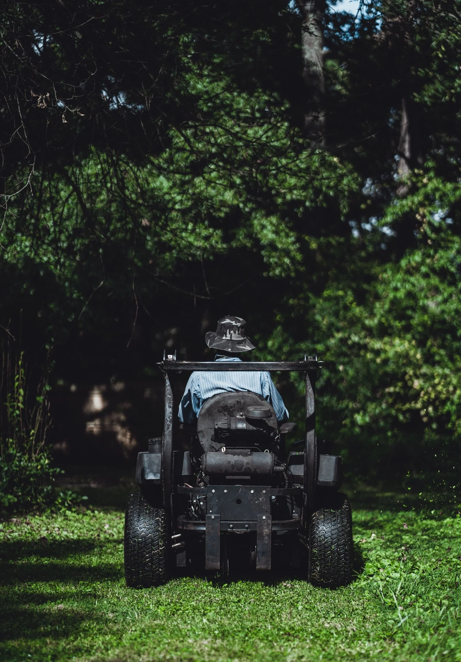 Zero-turn mower cutting a green lawn