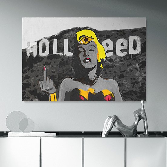 Pop art-style painting of a woman with yellow hair and Wonder Woman outfit, holding up her middle finger with the word 'KOLL' visible in the background.