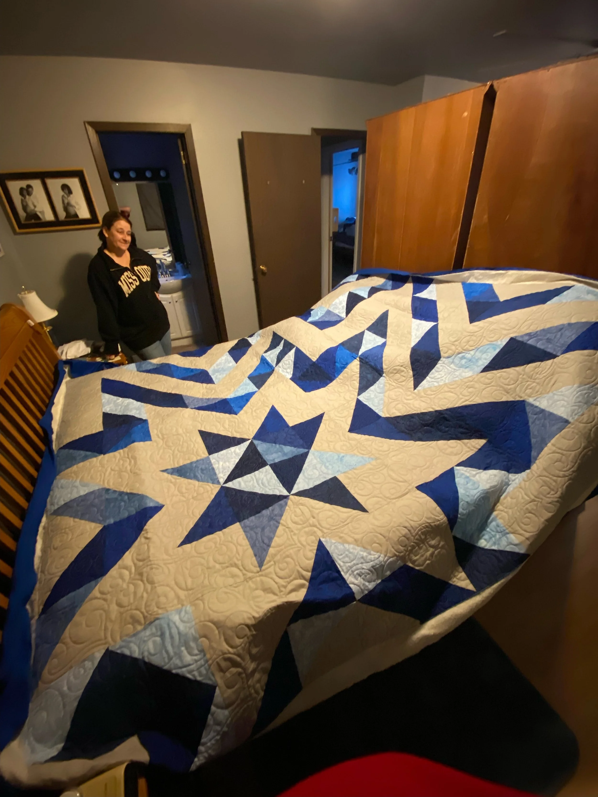 Blue and white star pattern quilt.