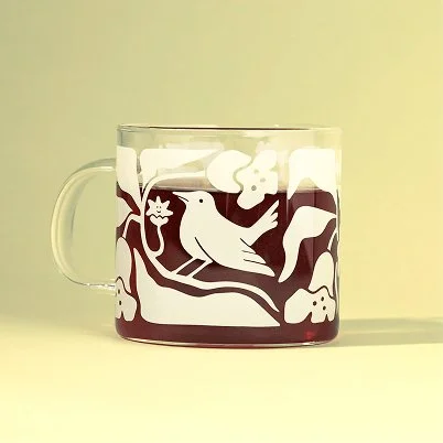 Glass tea mug with Keats & Co tea brand design etched
