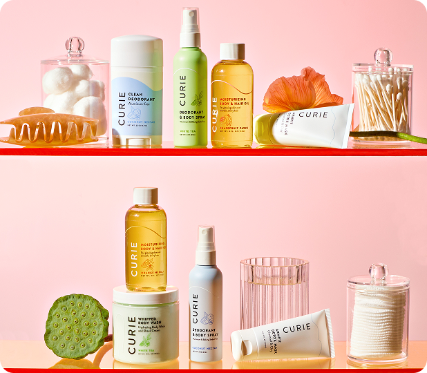 Curie deodorant and body care products styled on shelves with bathroom accessories