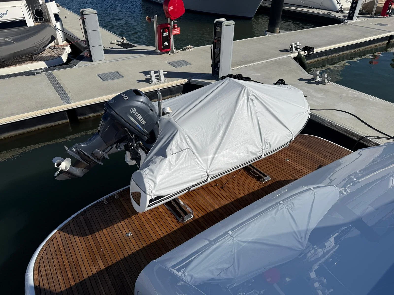93' Warren luxury yacht tender and restored teak deck as part of ongoing vessel care and maintenance on the Gold Coast